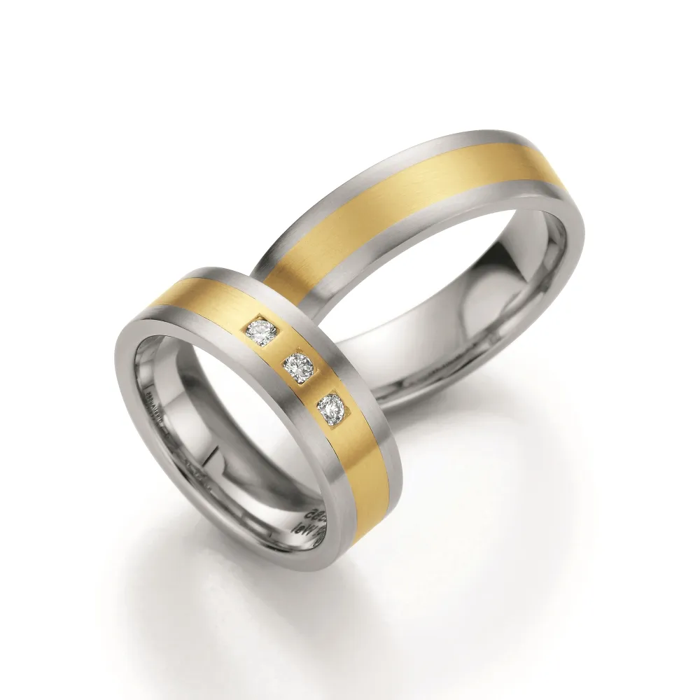 Alianzas de boda de acero y oro amarillo con diamantes