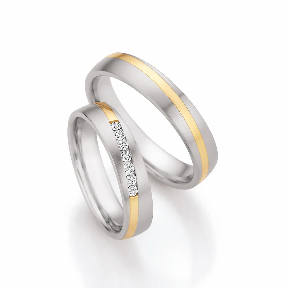 Alianzas de boda de acero y oro amarillo con diamantes