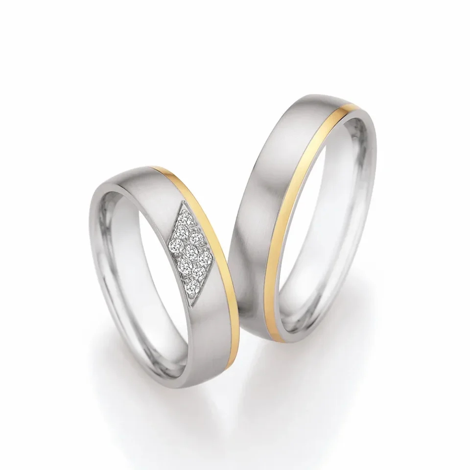 Alianzas de boda de acero y oro amarillo con diamantes