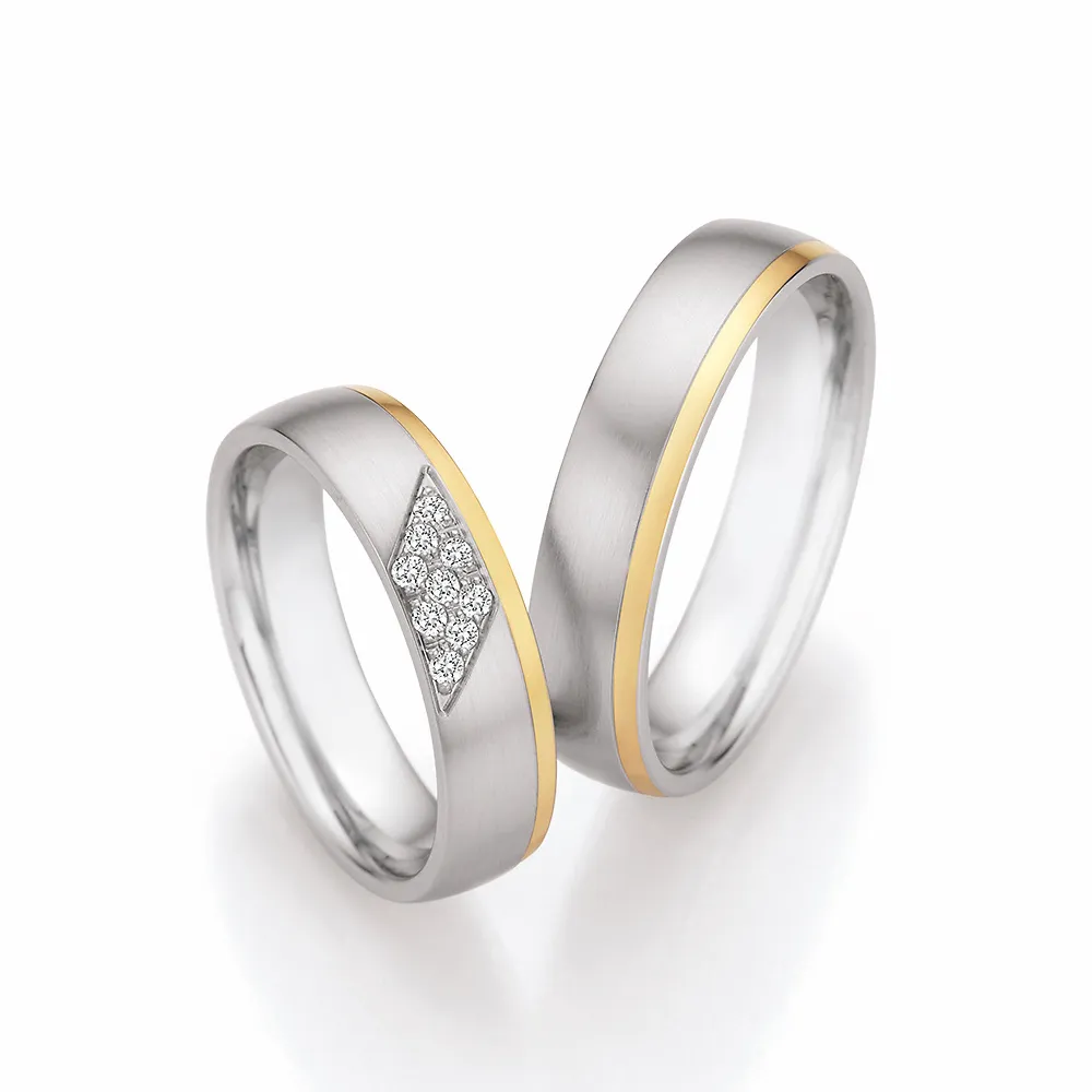 Alianzas de boda de acero y oro amarillo con diamantes