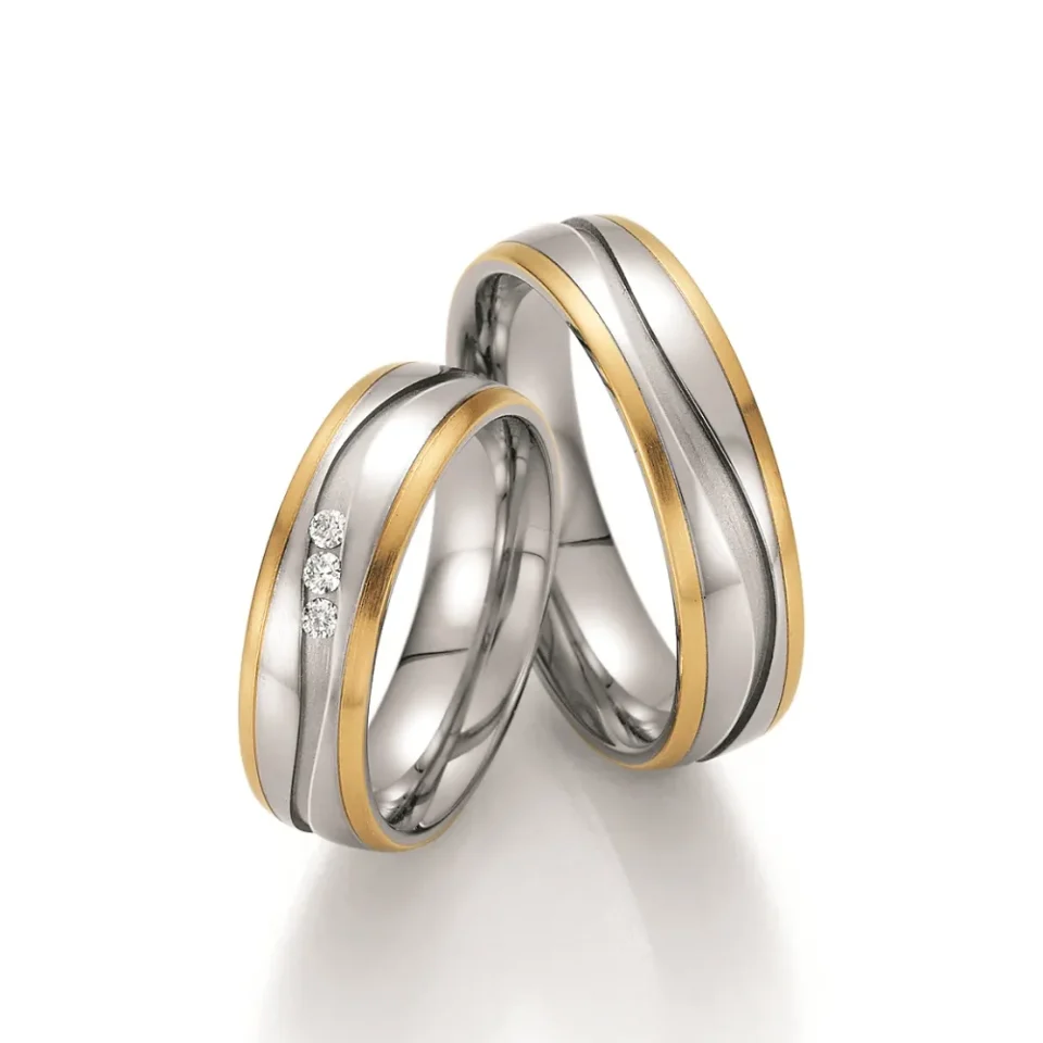 Alianzas de boda de acero y oro amarillo con diamantes