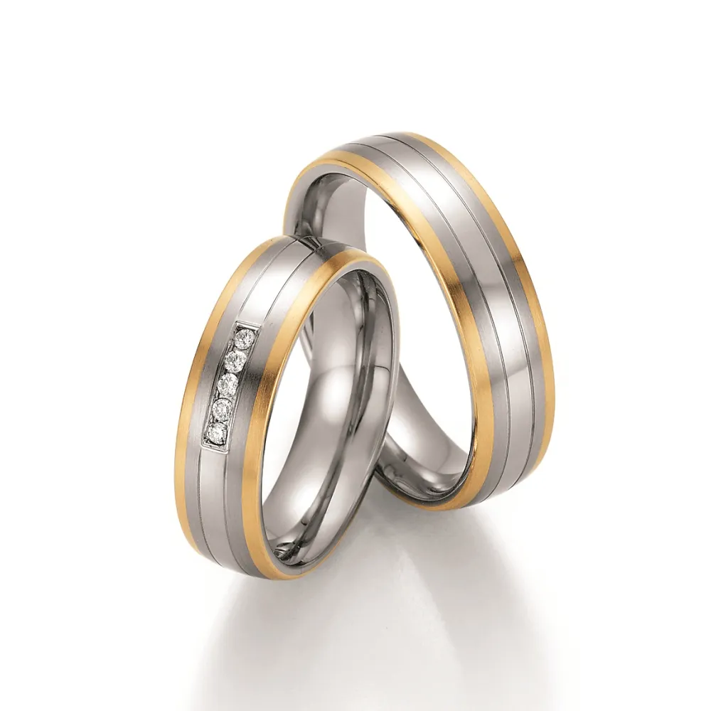 Alianzas de boda de acero y oro amarillo con diamantes