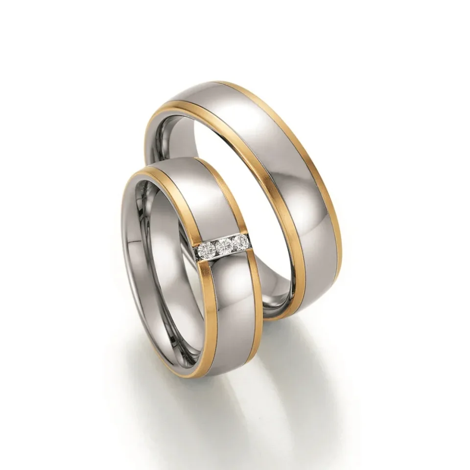 Alianzas de boda de acero y oro amarillo con diamantes