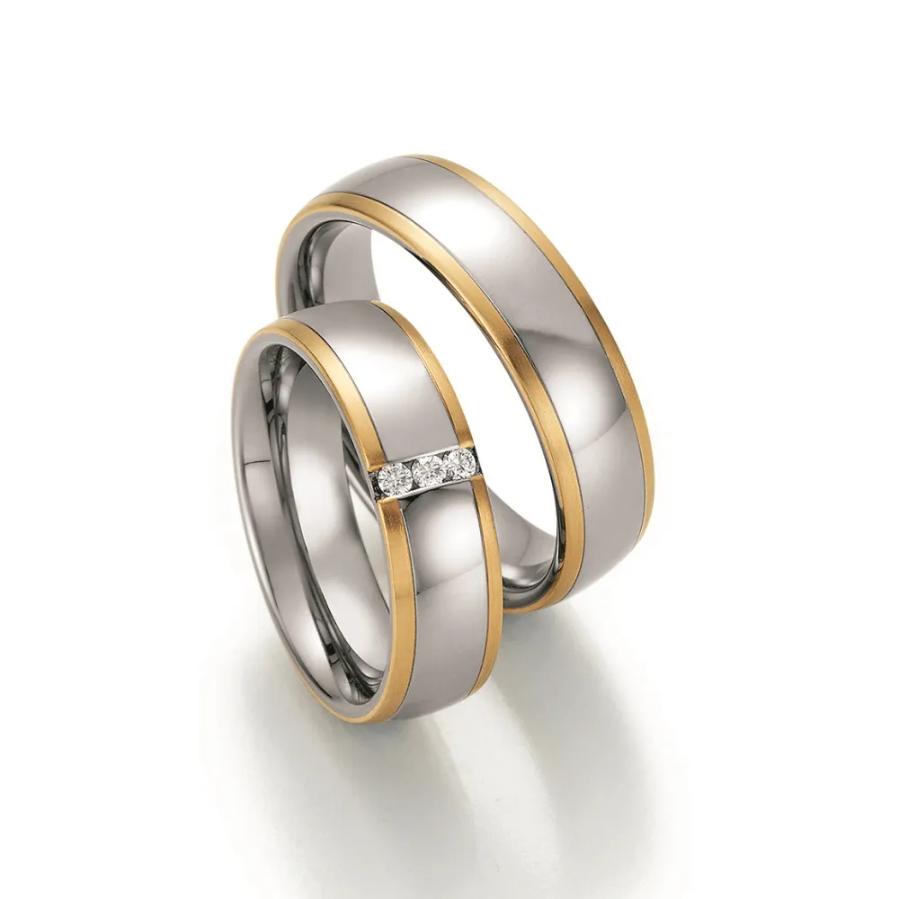 Alianzas de boda de acero y oro amarillo con diamantes