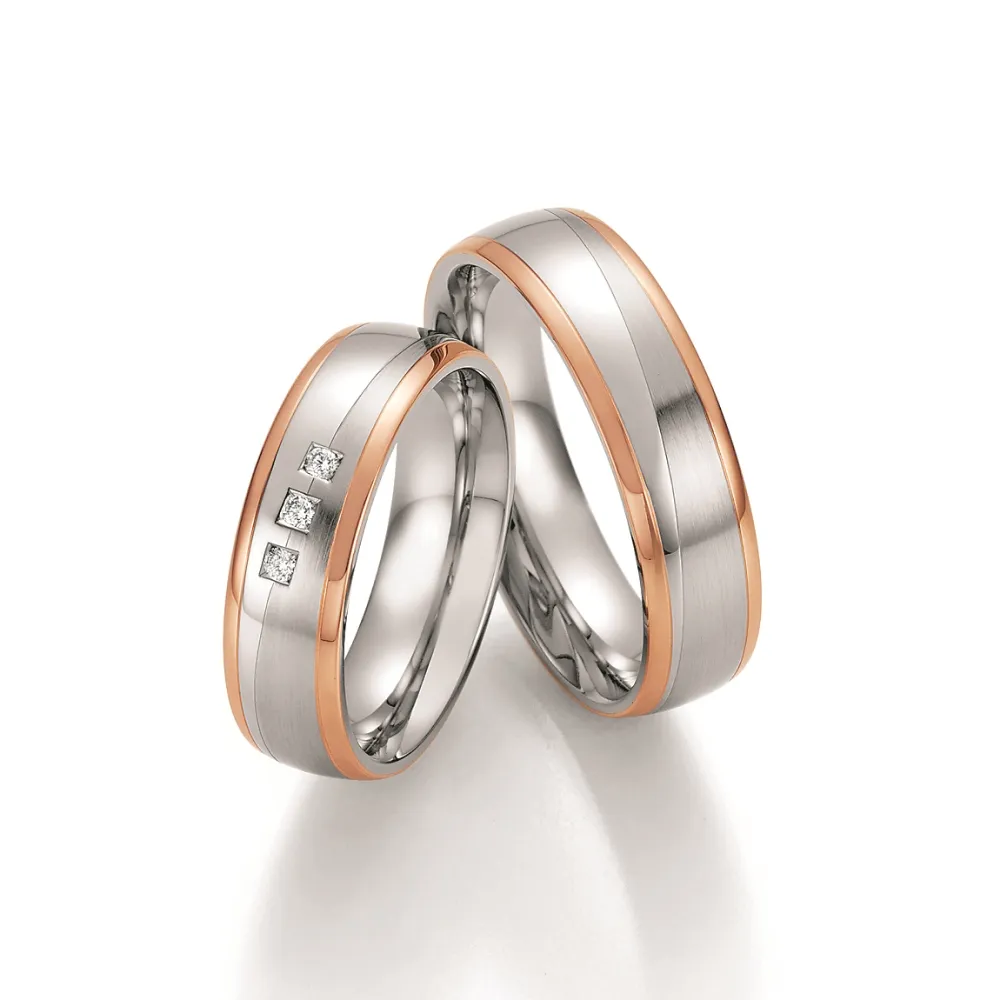 Alianzas de boda de acero y oro rosado con diamantes