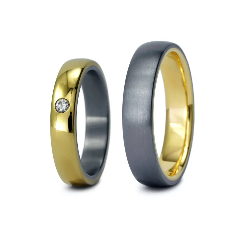 Alianzas de boda de tántalo y oro amarillo con diamante