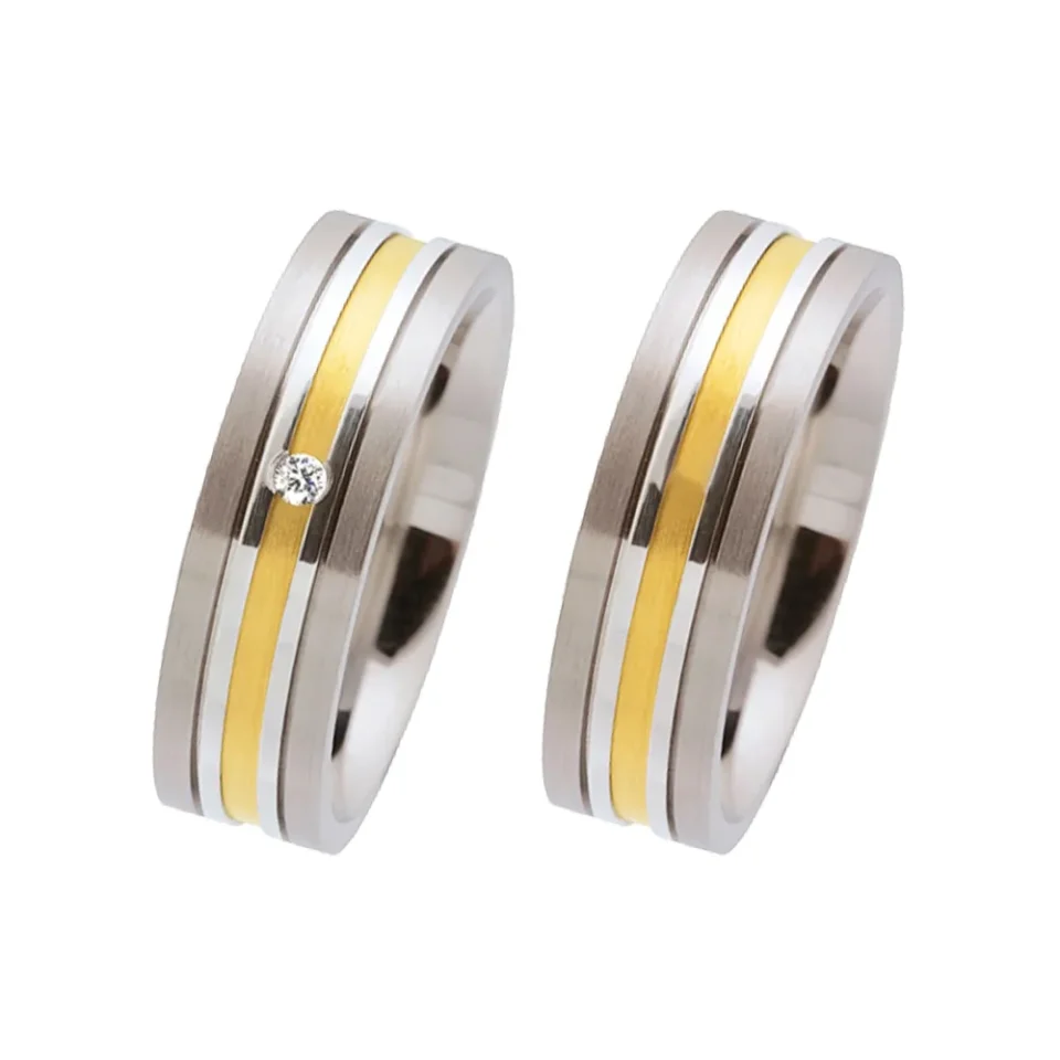 Alianzas de boda de acero y oro amarillo con diamante